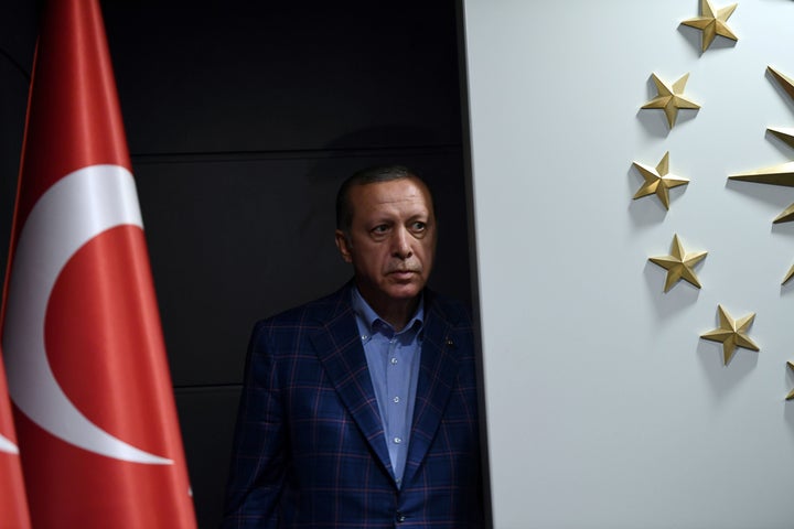 Erdogan looks on before delivering a speech after the referendum results. Istanbul, April 16.