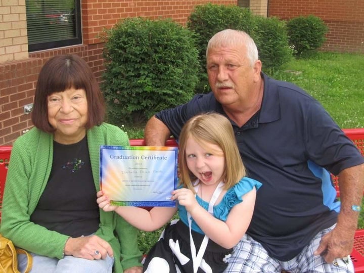 Kim and David Hoskin with one of their granddaughters.