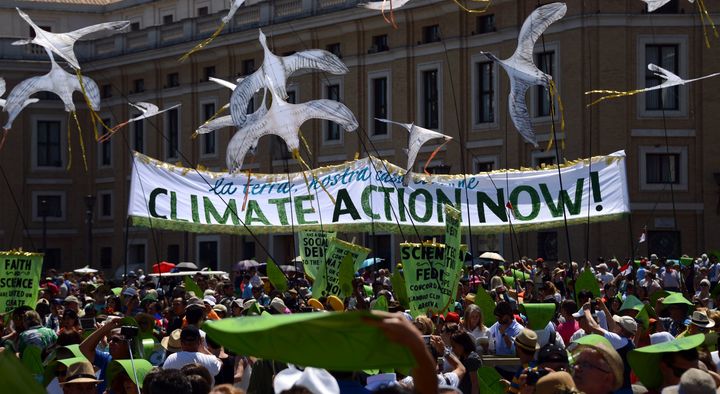 Environmental activists arrive on St. Peter's square prior to Pope Francis's Sunday Angelus prayer on June 28, 2015 at the Vatican.