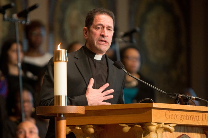 Rev. Timothy Kesicki, president of the Jesuit Conference, addresses a Liturgy of Remembrance, Contrition and Hope on the camp