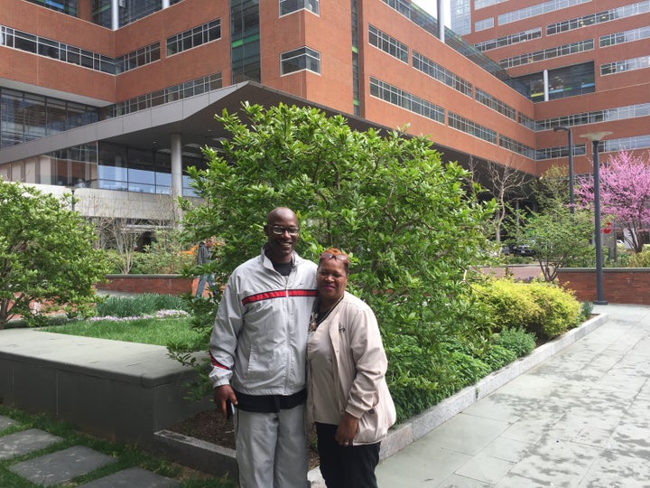 William Glover-Bey and Collie Thomas pose outside the Johns Hopkins Hospital in Baltimore. They are alumni of Turnaround Tuesday, a nonprofit program that helps ex-offenders find jobs.