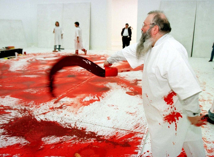 Austrian artist Hermann Nitsch in an earlier happening at Vienna's Modern Art Museum.