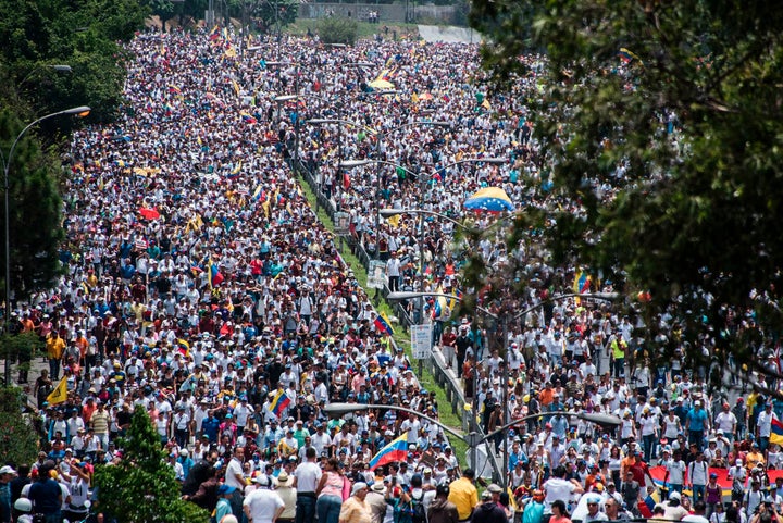 Opposition demonstrators march against the government of Venezuelan President Nicolas Maduro, in Caracas. 