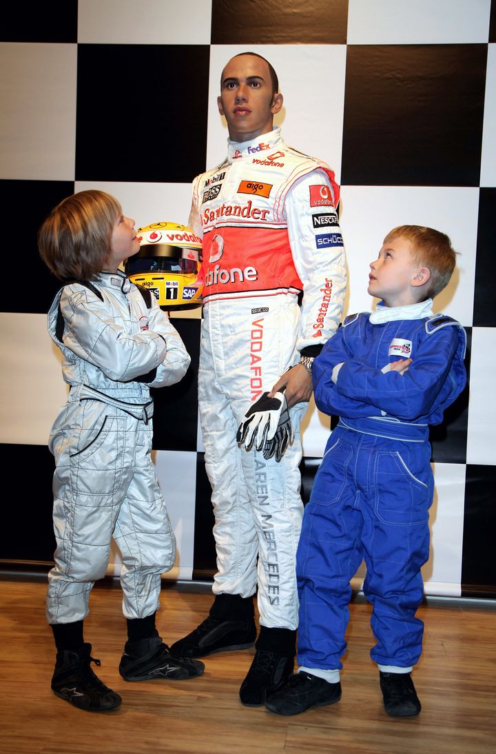 Billy, left, and Myles Apps, pose next to a waxwork of Hamilton after it was unveiled at Madama Tussauds in March, 2009