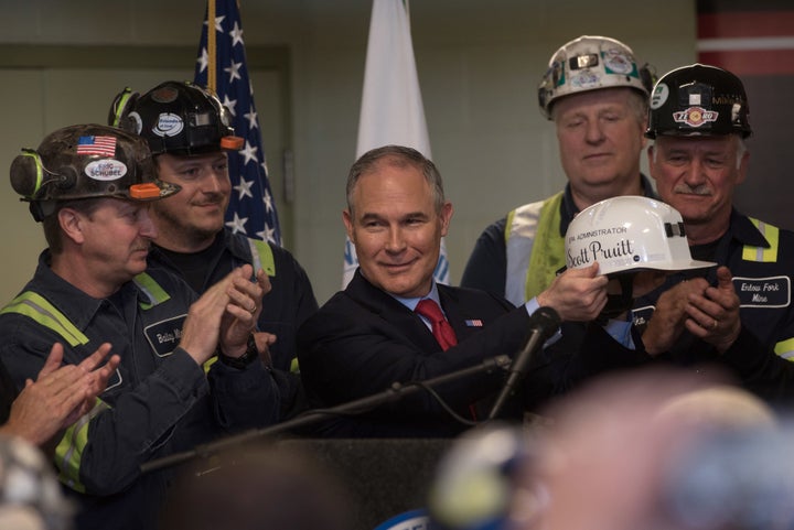 EPA administrator holds up a miner's helmet that he was given after speaking with coal miners at the Harvey Mine on April 13, 2017 in Sycamore, Pennsylvania.