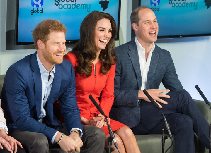 Prince William, Duke of Cambridge, Britain's Catherine, Duchess of Cambridge and Britain's Prince Harry tour a TV studio during the official opening the Global Academy.