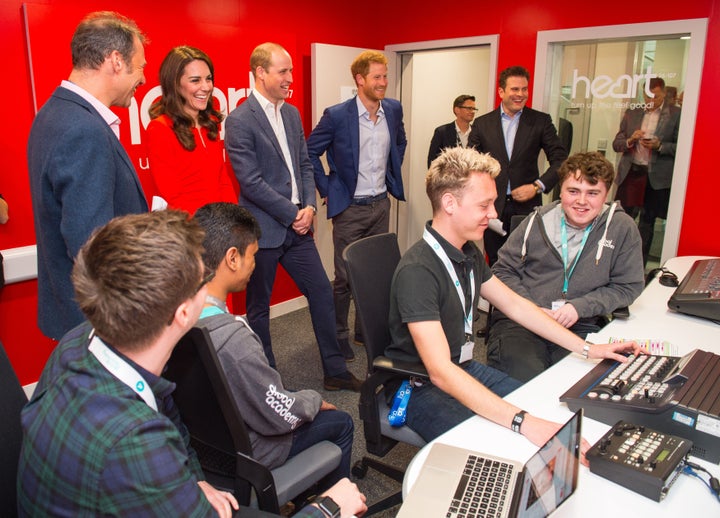 Duchess of Cambridge, Duke of Cambridge and Prince Harry visit a radio studio control room during the official opening of the Global Academy.