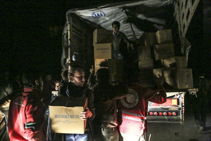 <p>The Syrian Arab Red Crescent and local Syrian committees unloading trucks with food and medicine for a besieged city. But all too often cities go without these deliveries. The UN is calling for complete and unrestricted access to civilians across Syria.</p>