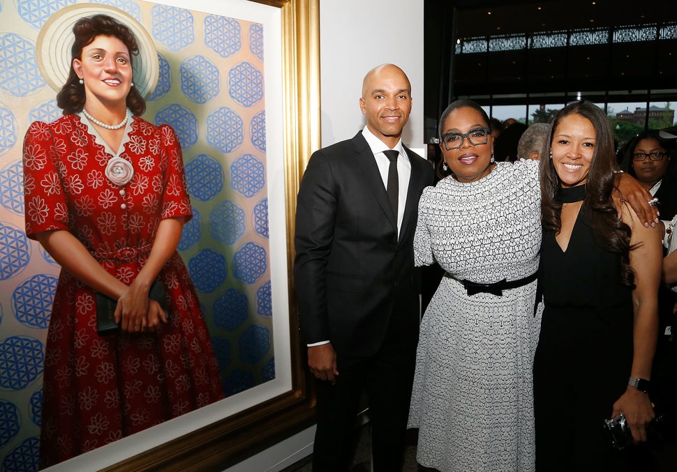 Oprah Winfrey, center, Dr. Jungmiwha Bullock, right, and artist Kadir Nelson, left, with his painting of Henrietta Lacks, att