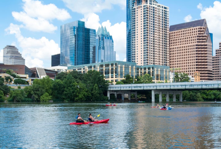 People canoeing on Lady Bird Lake in Austin