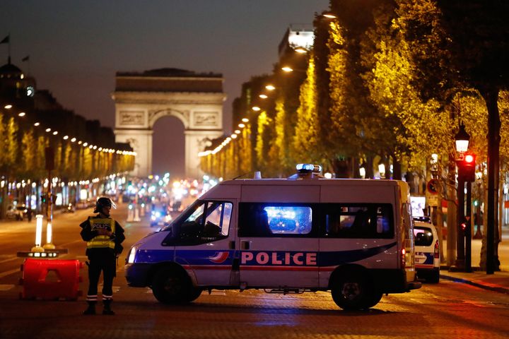 Police secure the Champs Elysees Avenue after one policeman was killed and another wounded in a shooting incident in Paris, France.