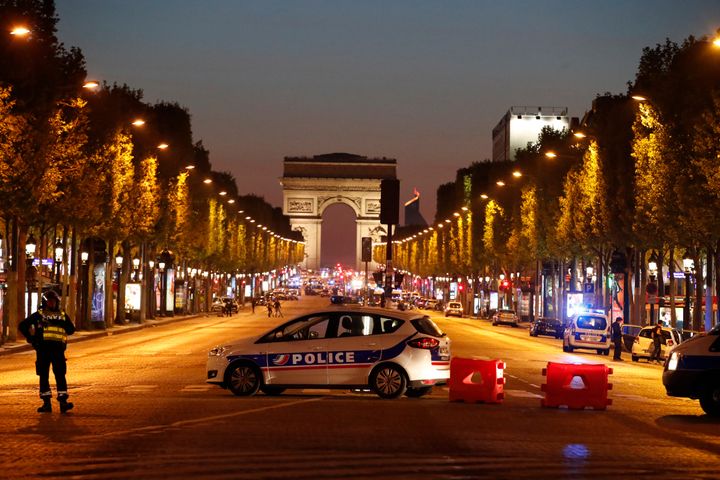 Police secure the Champs Elysee Avenue after one policeman was killed and another wounded in a shooting incident in Paris, France.