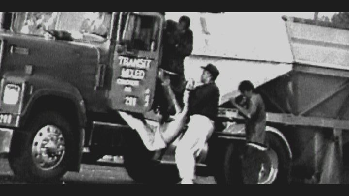 Reginald Denny being dragged from his truck.