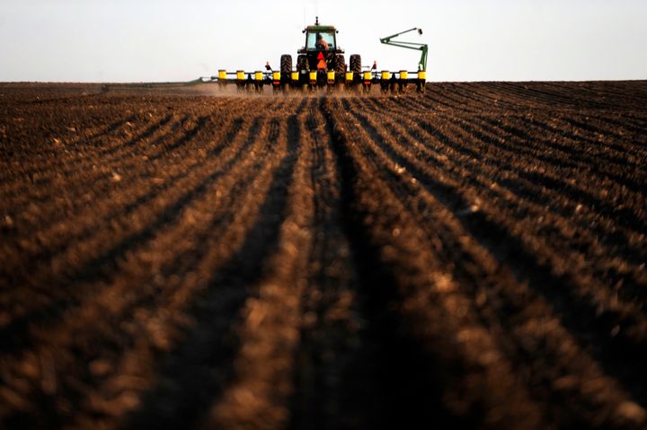 An Iowa farmer prepares for an evening planting of corn. Columnist Art Cullen has been pushing back against the state's agribusiness lobby, and now has a Pulitzer to show for it.