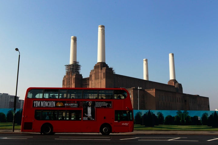 A bus passes the Battersea Power Station, a decommissioned coal plant, in London in 2011.