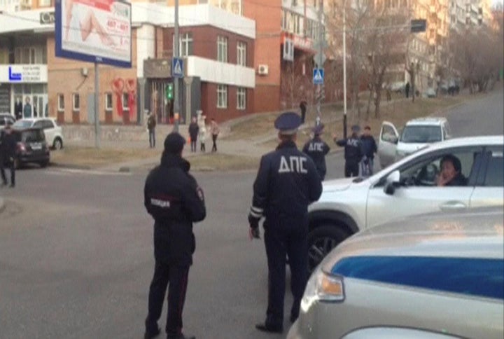 A still image from a video footage shows Interior Ministry officers block a street near a regional office of Russia's Federal Security Service (FSB), which was attacked by a gunman, in Khabarovsk, Russia, April 21, 2017.