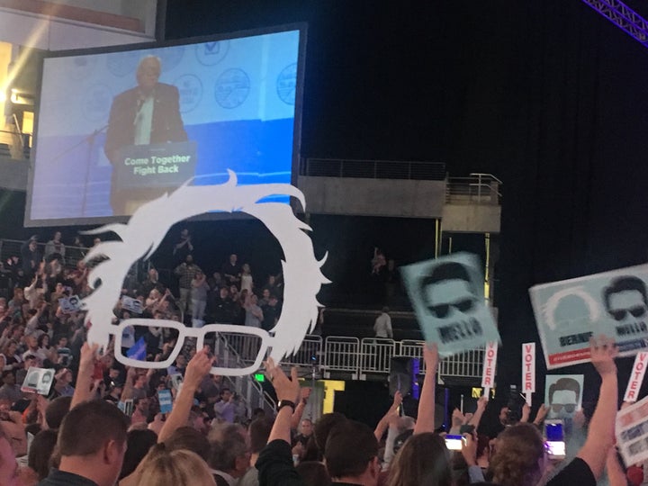 The crowd at a Democratic rally in Omaha, Nebraska, held signs with the outline of Bernie Sanders alongside that of Heath Mello.