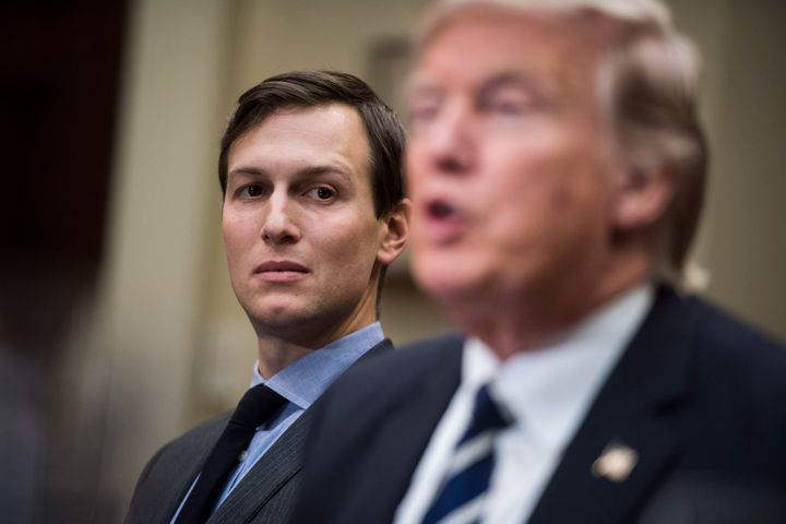 Jared Kushner, senior adviser and son-in-law, listens to Donald Trump during a White House session with cybersecurity experts.