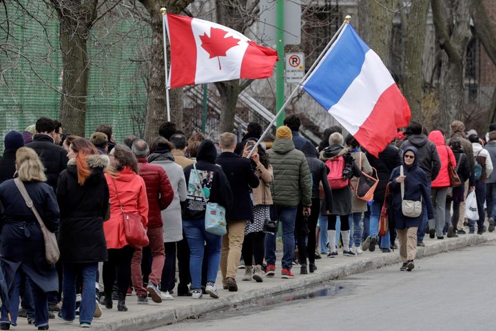 French citizens line up to cast their vote for Sunday's French presidential election at the College Stanislas in Montreal, Quebec, Canada, April 22, 2017.