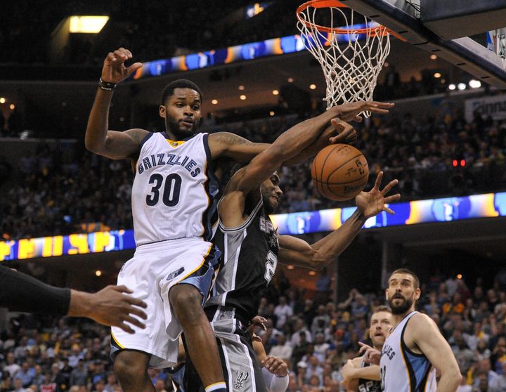Memphis Grizzlies guard Troy Daniels (30) and San Antonio Spurs forward Kawhi Leonard (2) fight for the rebound during the second half in game four of the first round of the 2017 NBA Playoffs at FedExForum. Memphis Grizzlies defeated the San Antonio Spurs 110-108 in overtime.