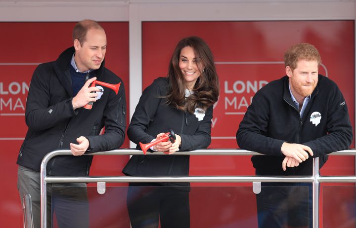 The Duke and Duchess of Cambridge signal the start of the marathon, as Prince Harry watches on