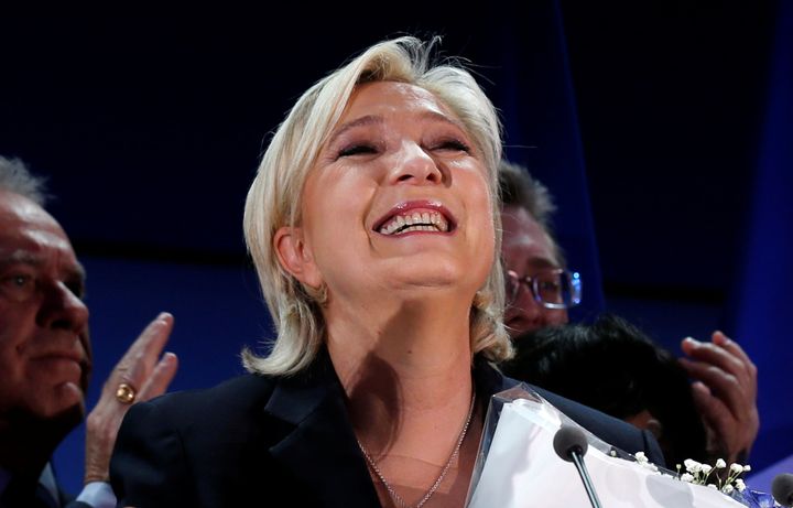 Marine Le Pen celebrates after early results in the first round of the 2017 French presidential election. 