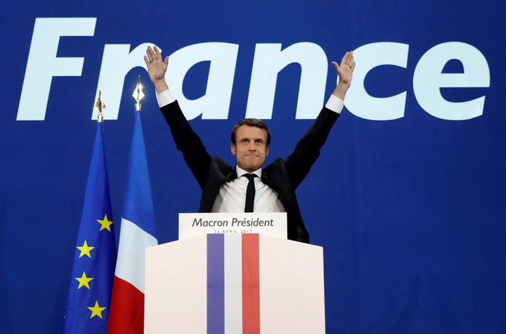 Emmanuel Macron celebrates after partial results in the first round of 2017 French presidential election, at the Parc des Expositions hall in Paris.