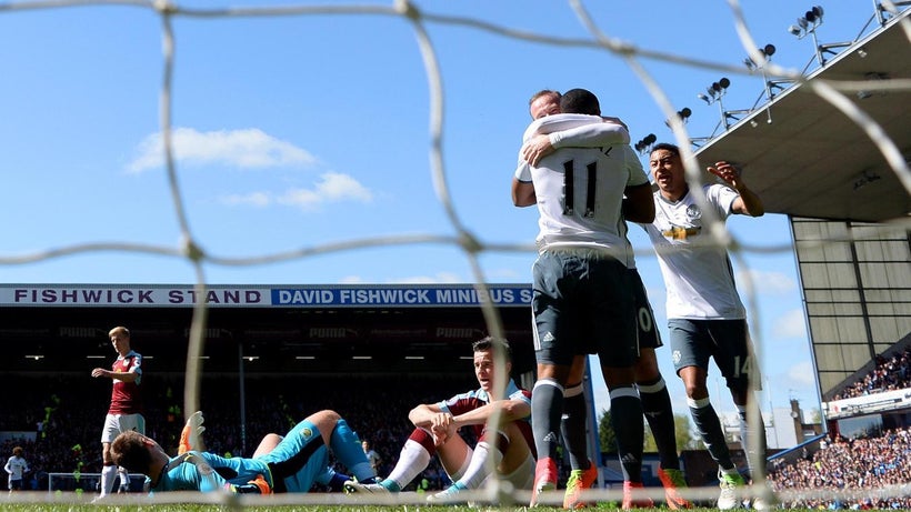 Goalscorers Wayne Rooney and Anthony Martial celebrate after making it 0:2 to United at Turf Moor on Sunday 23 April.