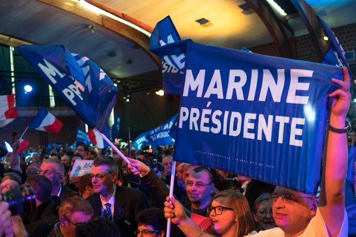 Le Pen supporters cheer her victory at the first round of elections on Sunday
