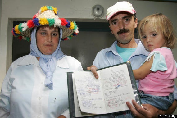 Bushra Binhisa - who was mistaken for Madeleine - with her parents and her family’s registration certificate