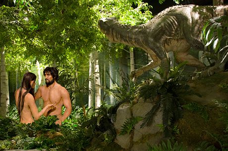 Eve, Adam, and a dinosaur meet in the Garden of Eden according to a Creation Museum display.