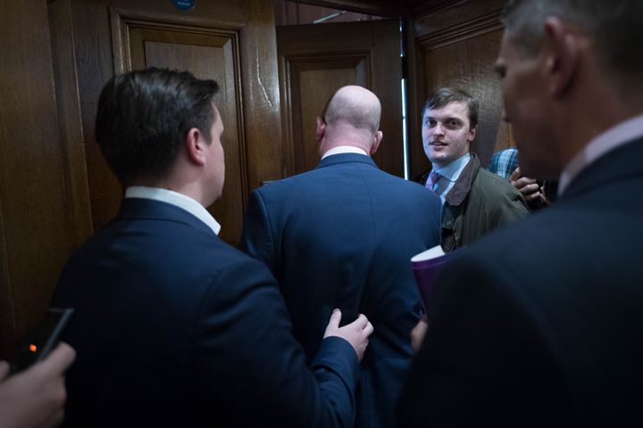 Paul Nuttall is ushered into a room, pursued by journalists