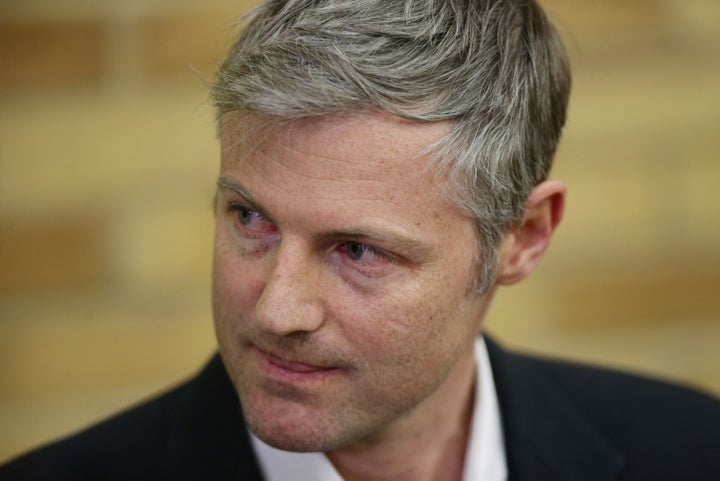 Zac Goldsmith listening to newly-elected Liberal Democrat MP Sarah Olney speaking, during the Richmond Park by-election.