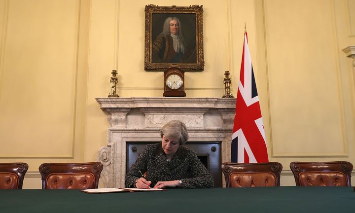 Theresa May signing the Article 50 letter triggering Brexit talks.