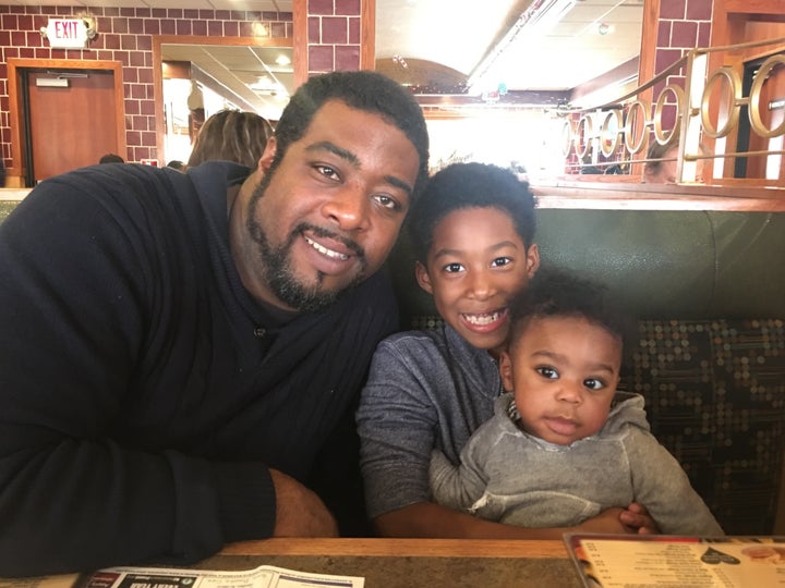 Leo Bridgewater left poses for a photo with his two sons, Leo Jr. (middle) and Langston (right).