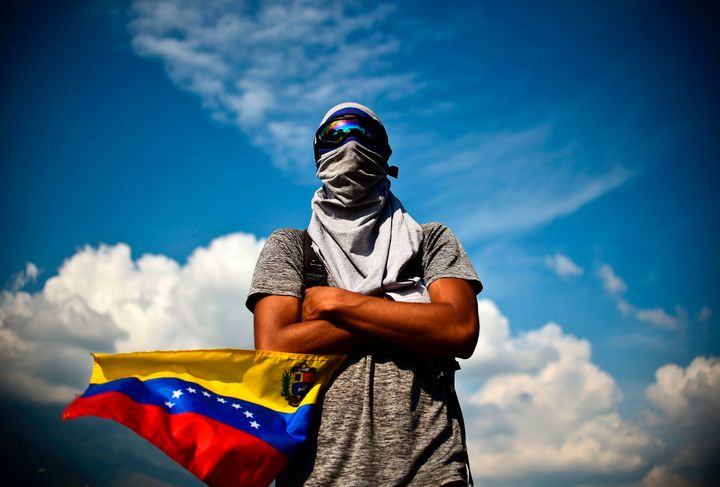A Venezuelan opposition activist demonstrates against President Nicolas Maduro in Caracas, on April 24, 2017.