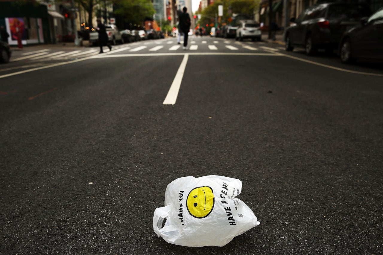 A plastic bag sits on a Manhattan street on May 5, 2016. Plastic bags are used for an average of 12 minutes each. But it could take up to 500 years or more for a plastic bag to degrade in a landfill. 