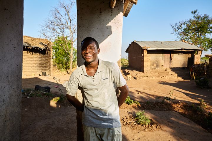 John (18) stands on the porch of his gowelo, Thyolo District, Malawi, 2016. John’s parents died in a car accident in 2005. “When I heard that I was going to help build my own house I was very happy. I asked my relatives to help me organise some bricks. “ John is waiting to hear if he has passed his high school exams, after which he would like to study art. He has a passion for music videos, and is convinced there is much room for improvement when it comes to editing and cinematography. “Some of the music videos in Malawi are good, but many are not good at all. I want to make the good ones better.” 