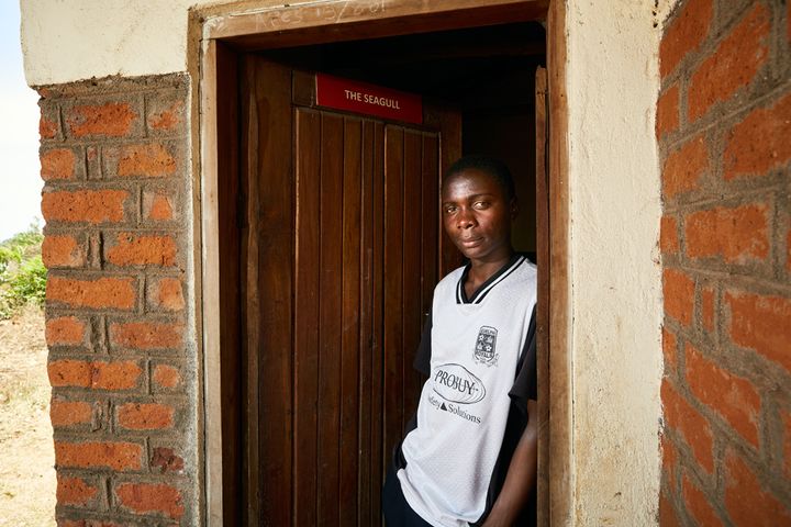 Mphatso stands in the doorway of his gowelo. Like Elias, Mphatso was involved in the gowelo program from the very beginning. After Margriet Sacranie-Simons, the charities’ director, saw what he was capable of, she asked him to help organise and distribute the building materials needed to build the gowelos. Currently, Mphatso is working to improve the biogas facitilies at Green Malata, the nearby entrepreneurial training village. He has also built a workshop complex with some of his firends which he hopes to rent out to small businesses. 