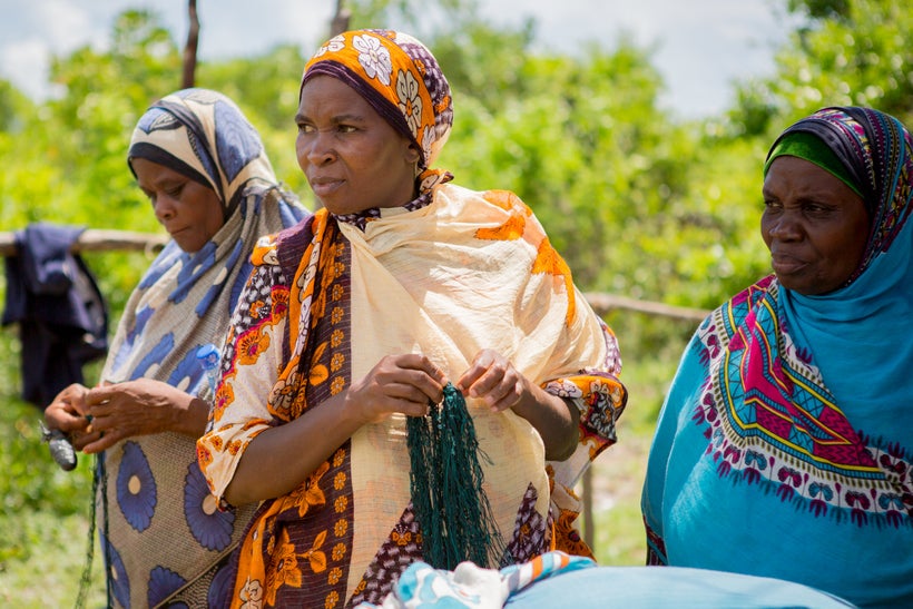 Women seaweed farmers from Zanzibar holding the tubular nets they have designed with SeaPower, a Blue Economy Challenge winne