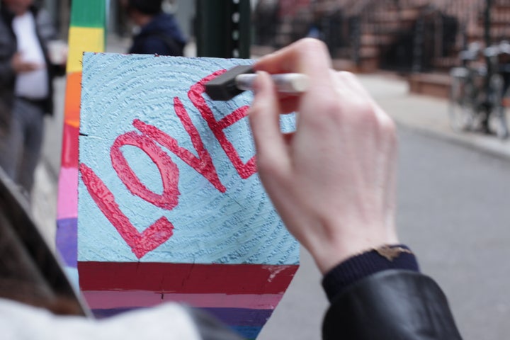 Photographer Kevin Gallagher's girlfriend Mariah wrote "Love" on the cross.