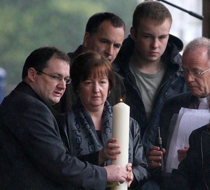 Melanie Jones lights a candle for her murdered son Rhys in Liverpool