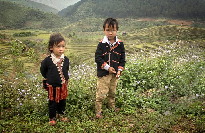 This brother and sister are members of the Dao ethnic minority in northern Vietnam. They were walking home from school near Mu Cang Chai. 