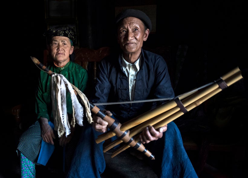 <strong>This man is holding a flute that he played for us while he danced. </strong>