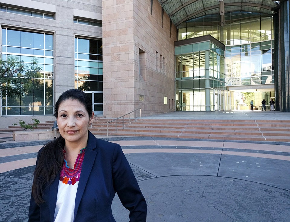 Eréndira Castillo, who has defended immigrants facing criminal deportation charges for the last two decades, stands in front of the federal courthouse in Tucson, Arizona. 