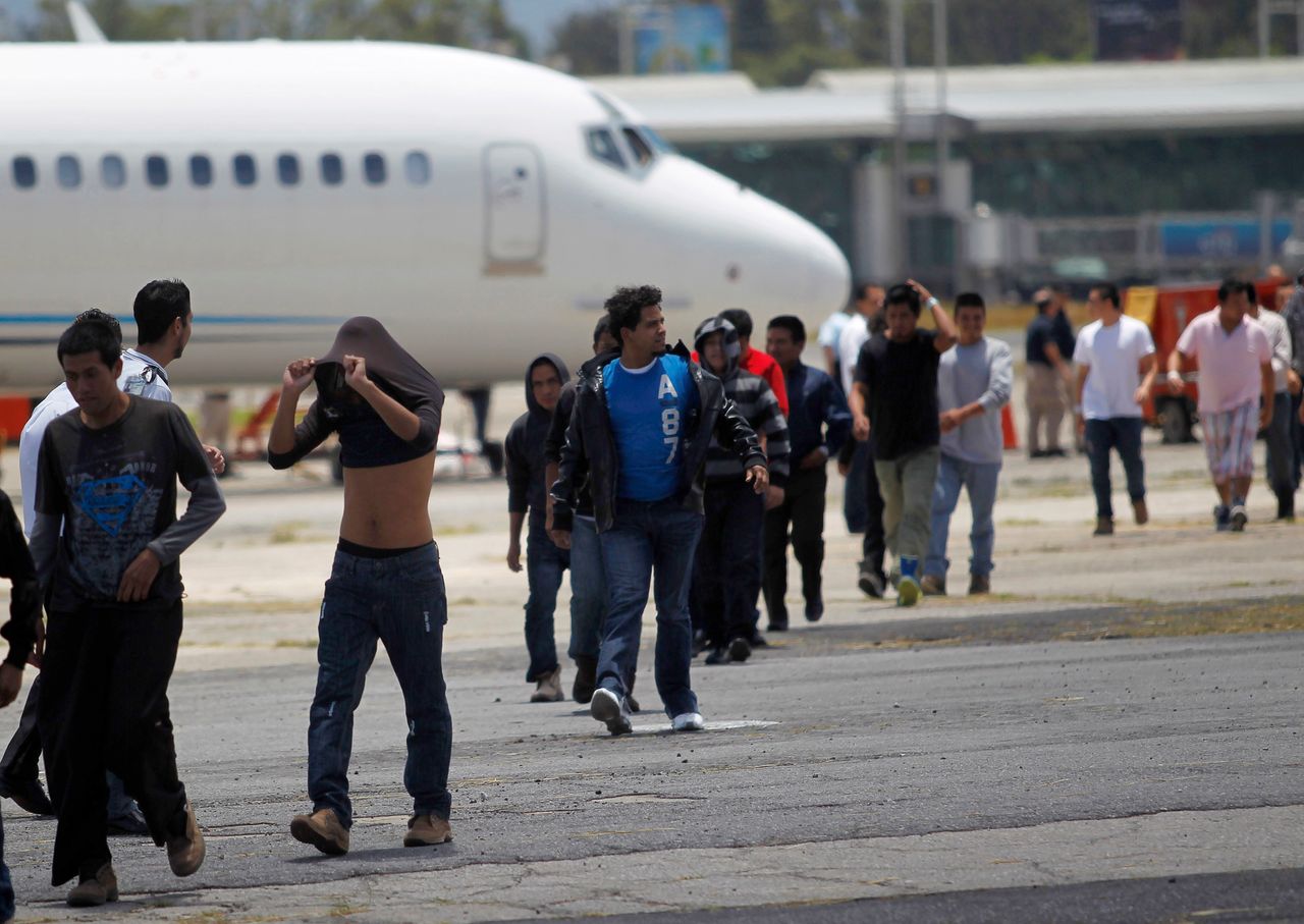 Immigrants deported from Arizona arrive at an air force base in Guatemala City on July 22, 2014.
