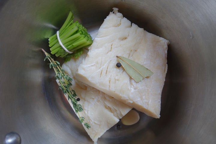 <p>The soaked cod ready to be poached in a mixture of water and milk</p>