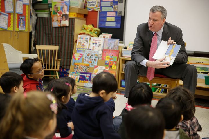 New York City Mayor Bill de Blasio reads to children in a pre-kindergarten class at P.S. 130 on February 25, 2014 in New York City.