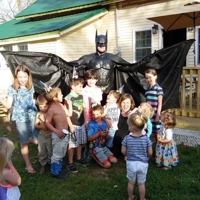 James dressed up as Batman at a birthday party.