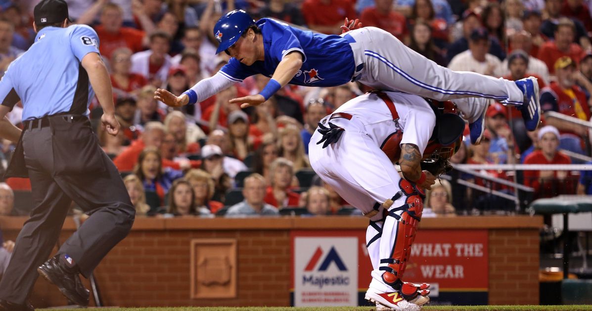 St. Louis Cardinals Yadier Molina slides into home plate safely